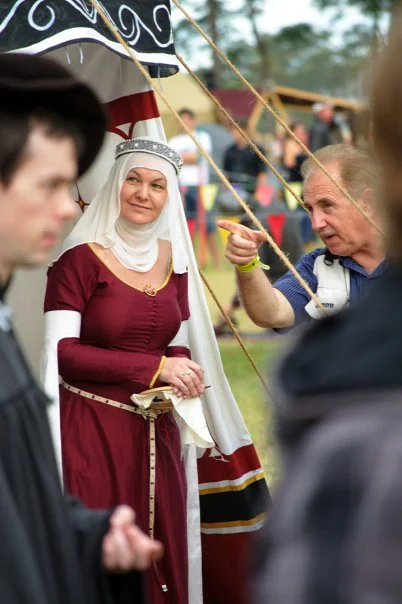 The festival exists in two registers at once — medieval and now. The best portraits are the ones where you can feel both.