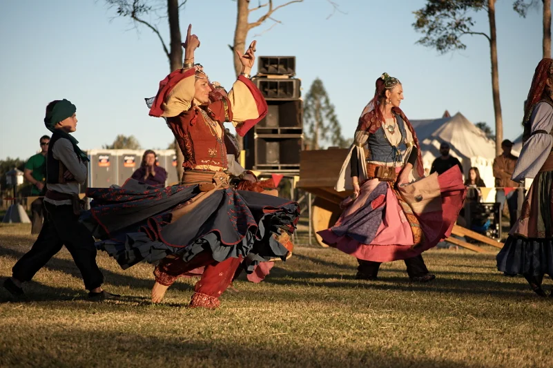 The dancers arrive as the light goes gold and the crowd thins out. That is when the festival becomes something else entirely.