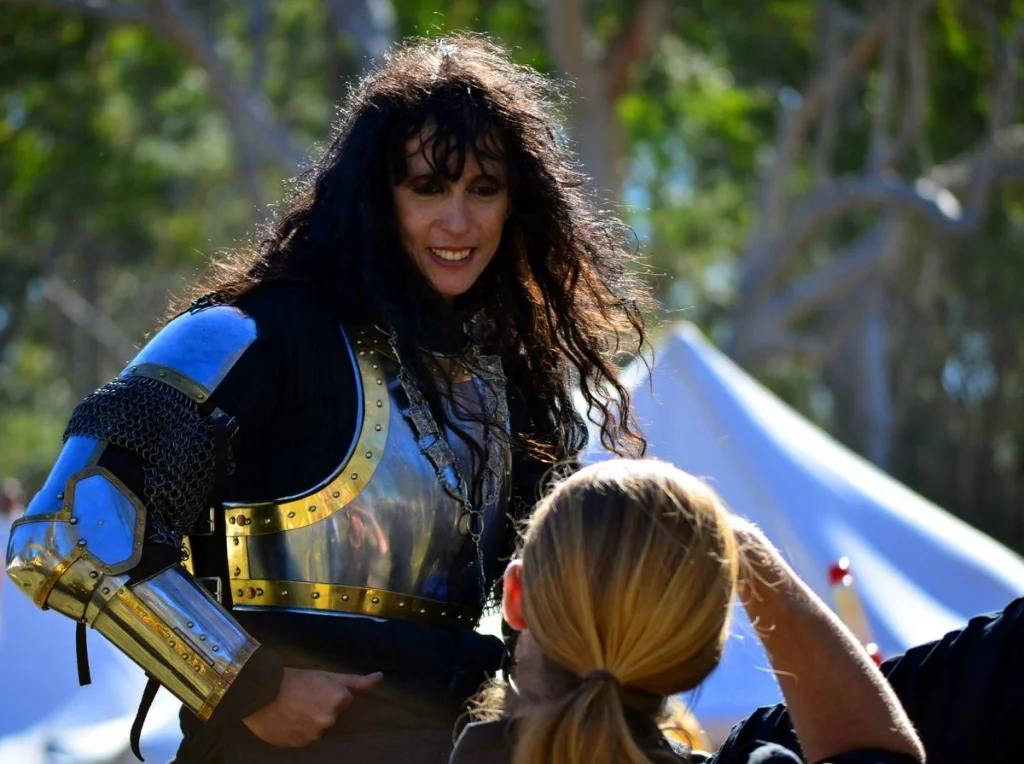 She was smiling at someone on the ground after the bout. The armour was beautiful. The smile was better.