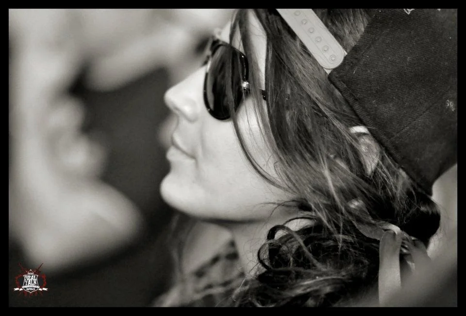 A side profile, sunglasses, snapback worn backward, long hair moving. I had one frame that was sharp. This was it.