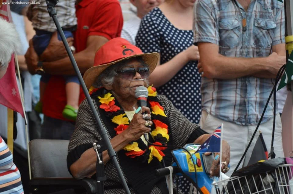 She is at the microphone with an Aboriginal flag lei around her neck, speaking to the crowd. The derby has always held space for this.