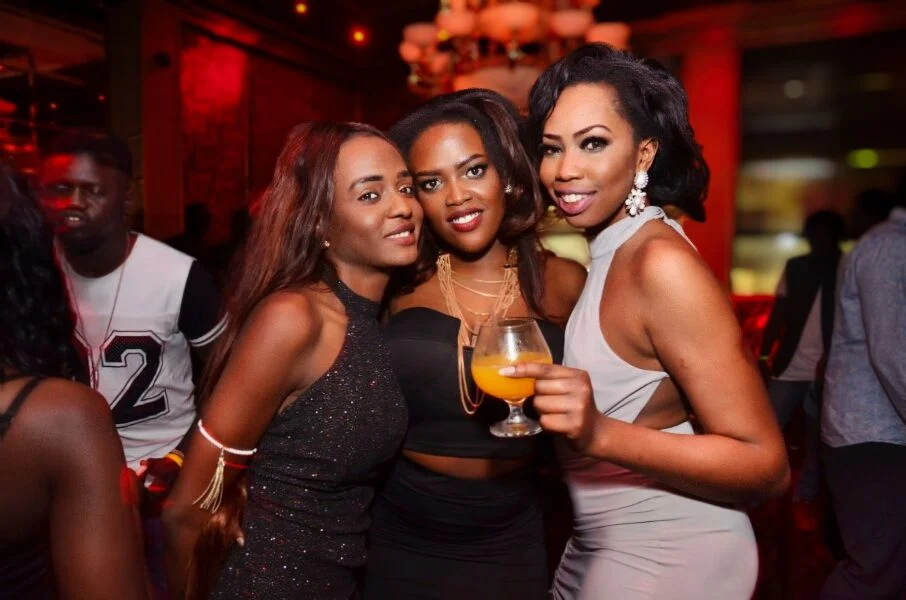 Three friends at a club at 11pm are not posing for posterity — they are living in the moment. Photograph the moment, not the pose.