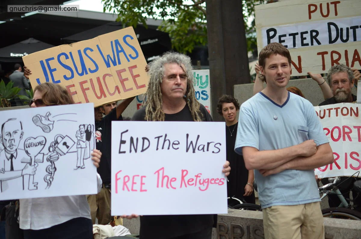 The most durable protest signs are the ones that flip the establishment's own language back on it. Theological arguments are hard to refute from a ministerial press release.
